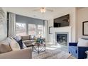 Cozy living room with fireplace, large windows, and comfortable seating area at 929 Maya Layne Dr., Little River, SC 29566