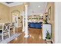 Open-concept living space with hardwood floors, decorative pillars, comfortable furniture, and natural light at 120 Henry Middleton Blvd., Myrtle Beach, SC 29588