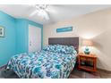 Inviting bedroom with blue patterned bedding and charming bedside decor at 1210 N Waccamaw Dr. # 212, Garden City Beach, SC 29576