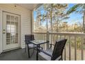 Private balcony with seating area, perfect for enjoying the outdoors at 1220 River Oak Dr. # 22C, Myrtle Beach, SC 29579