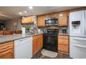 Well-equipped kitchen with stainless steel appliances, tile backsplash, and granite countertops at 1301 Pridgen Rd. # 1101, Myrtle Beach, SC 29577