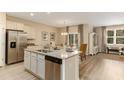Open-concept kitchen with stainless steel appliances, granite countertops, and a view into the dining area at 1454 Porchfield Dr., Conway, SC 29526