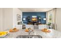 Open-concept kitchen showcasing granite countertops and modern stainless steel appliances at 1459 Porchfield Dr., Conway, SC 29526