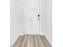 Clean, white interior door with modern hardware and wood-look flooring at 155 Joyce Dr, Longs, SC 29568