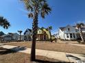 New construction home with bright yellow wrap, front porch, and situated on a grassy lot at 1587 Sayebrook Pkwy., Myrtle Beach, SC 29588
