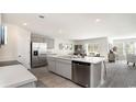 Open-concept kitchen with a large island, stainless steel appliances, and a view of the living area at 178 Ashworth Dr., Tabor City, NC 28463