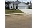 Charming single Gathering home with manicured front yard and three-car garage at 179 Glengrove Lane, Murrells Inlet, SC 29576