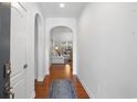 Elegant foyer featuring hardwood floors, archway details, and a glimpse into the living room at 2049 Oxford St., Myrtle Beach, SC 29577
