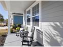 Cozy front porch showcasing comfortable rocking chairs and charming decorative accents at 2049 Oxford St., Myrtle Beach, SC 29577