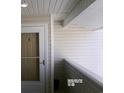 A close-up of the front door with sidelight, showcasing the entrance to the residence at 2257 Huntingdon Dr. # F, Surfside Beach, SC 29575