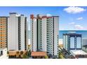 Beachfront condo exterior showcases several balconies overlooking a sandy shore and ocean at 2701 N Ocean Blvd. # 1857/1860, Myrtle Beach, SC 29577
