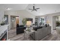 Open-concept living room with stylish furniture and hardwood floors at 304 Carolina Springs Ct., Conway, SC 29527