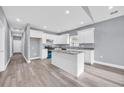 Modern kitchen featuring white cabinets, an island, stainless steel appliances, and gray countertop at 3837 Mayfield Dr., Conway, SC 29526