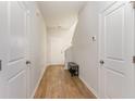 Bright entryway featuring hardwood floors, white walls, and a bench for convenience at 723 Joywood Dr., Longs, SC 29568