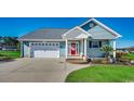 Charming single-story home with a well-manicured lawn, attached garage, and inviting red front door at 1525 Sunmeadow Dr., Conway, SC 29526