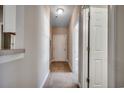 Inviting hallway with neutral colors, tiled entry, and carpeted flooring at 2005 Silvercrest Dr. # 32-B, Myrtle Beach, SC 29579