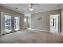 Bright living room with ceiling fan, and access to outdoor balcony at 2005 Silvercrest Dr. # 32-B, Myrtle Beach, SC 29579