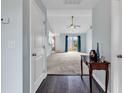 Inviting entryway featuring dark wood floors that open into a spacious living area at 206 Balsa Dr., Longs, SC 29568