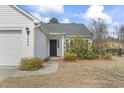 Close-up view of home's front door and well landscaped walkway and front yard at 2288 Beauclair Ct., Myrtle Beach, SC 29579
