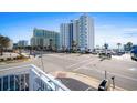 Street view of a beachside property with a view of the ocean and surrounding high-rise buildings at 2600 S Ocean Blvd. # 101, Myrtle Beach, SC 29577