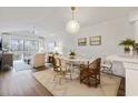 Stylish dining area with a modern light fixture and seamless access to the comfortable living area at 298 Pinehurst Ln. # 10-J, Pawleys Island, SC 29585