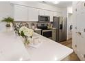 Well-equipped kitchen with modern appliances, light countertops, and ample cabinet space for efficient storage at 298 Pinehurst Ln. # 10-J, Pawleys Island, SC 29585