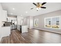 Spacious kitchen area features stainless steel appliances, a large island and a hardwood floor at 344 Kiskadee Loop # A, Conway, SC 29526