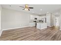 Bright living space with wood-look flooring and views of the kitchen and dining area at 344 Kiskadee Loop # A, Conway, SC 29526