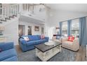 Spacious living room featuring high ceilings, nautical decor, and comfortable seating, perfect for Gathering gatherings at 409 36Th Ave. N, North Myrtle Beach, SC 29582