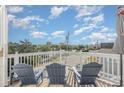 Relax on the rooftop deck featuring comfortable seating and panoramic views, perfect for enjoying the scenery at 409 36Th Ave. N, North Myrtle Beach, SC 29582