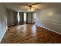 Spacious living room featuring beautiful hardwood floors and ample natural light at 412 Olive St., Georgetown, SC 29440