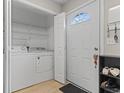 Welcoming entryway with coat closet, shoe rack, and washer/dryer at 4606 Lomax Ct. # 4606, Murrells Inlet, SC 29576