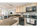 Galley kitchen with sleek countertops, modern appliances, and ample cabinet space at 4800 S Ocean Blvd. # 304, North Myrtle Beach, SC 29582