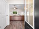 View of a large leather couch and ceiling fan, as seen from the doorway entrance of the living room at 5026 Adrian Hwy., Conway, SC 29526