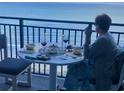 Oceanfront balcony with table set for relaxed dining and spectacular ocean view at 5523 North Ocean Blvd. # 2112, Myrtle Beach, SC 29577
