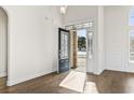 Open foyer with hardwood floors and a decorative glass front door with sidelights at 654 Evers Loop, Surfside Beach, SC 29575