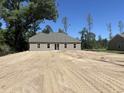 A spacious backyard shows a blank slate, awaiting a garden or entertaining area to be created at 8545 Pee Dee Hwy., Conway, SC 29527