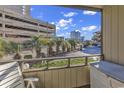 View from private balcony showing lush landscaping and adjacent building at 9501 Shore Dr. # D-132, Myrtle Beach, SC 29572