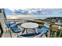 Relaxing ocean view from a private balcony with stylish outdoor furniture at 101 Ocean Creek Dr. # Mm-5, Myrtle Beach, SC 29572