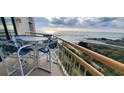 Inviting balcony with comfortable seating and beautiful ocean views at 101 Ocean Creek Dr. # Mm-5, Myrtle Beach, SC 29572