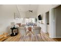 Bright living room with vaulted ceilings, wood floors, and modern furnishings, offering a comfortable living space at 1356 Glenns Bay Rd. # 202B, Surfside Beach, SC 29575