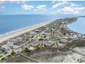 Aerial of this charming neighborhood near the ocean and waterway, showcasing the coastal lifestyle at 1581 S Waccamaw Dr. # 402, Garden City Beach, SC 29576