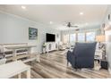 Bright living area with modern flooring and coastal decor, perfect for relaxation and entertainment at 1581 S Waccamaw Dr. # 402, Garden City Beach, SC 29576