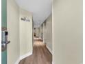Bright hallway with wood floors leading to the living areas of the condominium at 201 74Th Ave. N # 703, Myrtle Beach, SC 29572