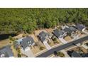 Aerial view of a residential neighborhood showcases homes with pools and mature landscaping at 3120 Bayhaven Dr., Myrtle Beach, SC 29579