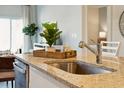 Close up view of the kitchen island featuring granite countertops and stainless steel sink at 316 Brackish Dr. # 316, Myrtle Beach, SC 29588