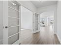 Open-concept living space with archway, light wood floors and lots of natural light at 3215 Preciado Dr., Myrtle Beach, SC 29579