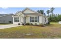 Well-maintained one-story house with manicured lawn and classic design at 3500 Church St., Loris, SC 29569
