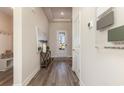 Inviting entryway features wood-look floors and a stylish decor at 399 Wingspan Ct., Myrtle Beach, SC 29588