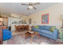 Comfortable living room open to the dining area with a ceiling fan and natural light at 4503 W Harbour Ct. # S-6, Little River, SC 29566